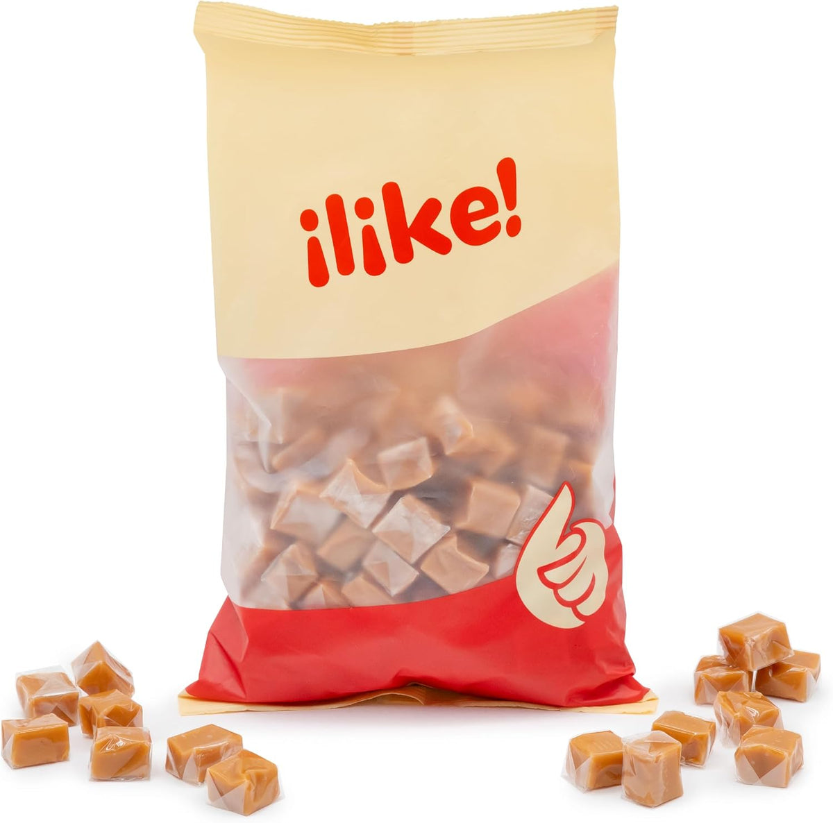 A scattered pile of unwrapped rich golden brown caramel squares showing their uniform cube shape.