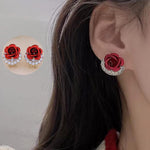 Zeshimb red rose blossom earrings close up detail