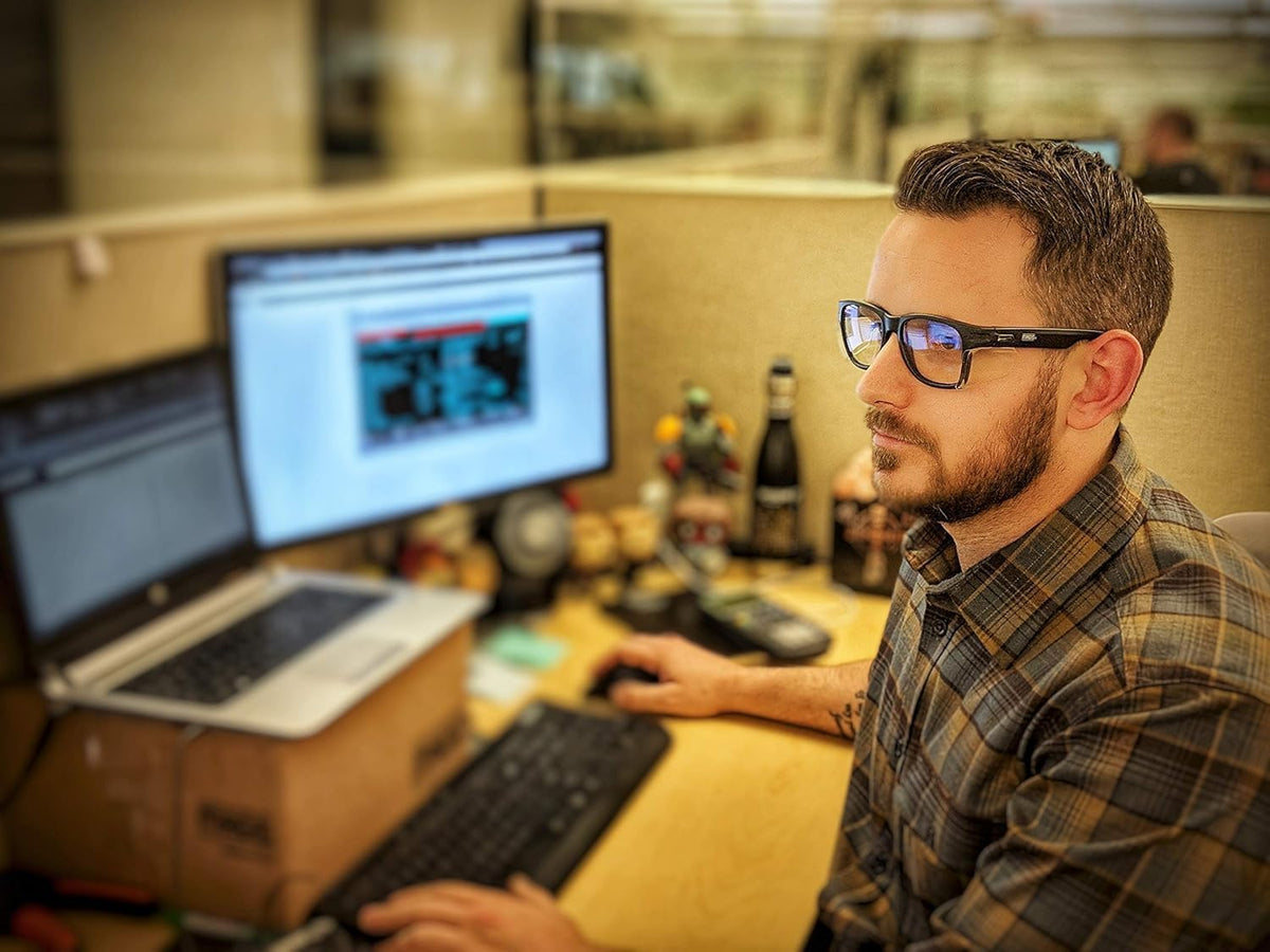 Magid Y50 safety glasses being held to demonstrate lightweight design