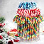 A selection of three distinct flavor variants of Yumzo candy canes highlighting the vibrant colors.