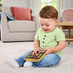 VTech interactive tablet directional pad and tactile buttons close up