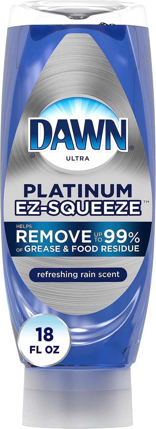 Dawn lemon essence dishwashing liquid next to sponge