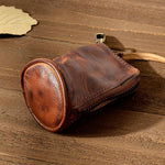 Yzikema leather storage bag held in hand for scale