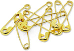 Solid brass safety pins laid out flat