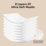 Contoured figure-8 shape burp cloth draped over shoulder