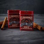 Compact portable tin of Clawhammer hot cinnamon candy