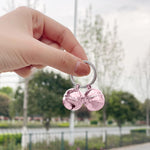 Handmade rust proof pink cat collar bells showcasing the 0.8 inch diameter metal design.