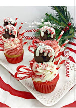 A decorative glass bowl filled with individually wrapped holiday candy canes.