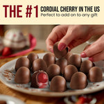 Close up of milk chocolate coated maraschino cherry candy