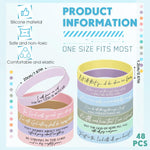 Close-up of silicone wristbands featuring debossed scripture text