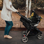 LBCASA infant car seat cover fitted securely over a modern baby stroller.