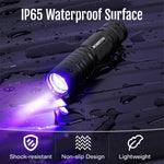 MOWETOO portable ultraviolet lamp verifying security features and fluorescent markings on paper currency.