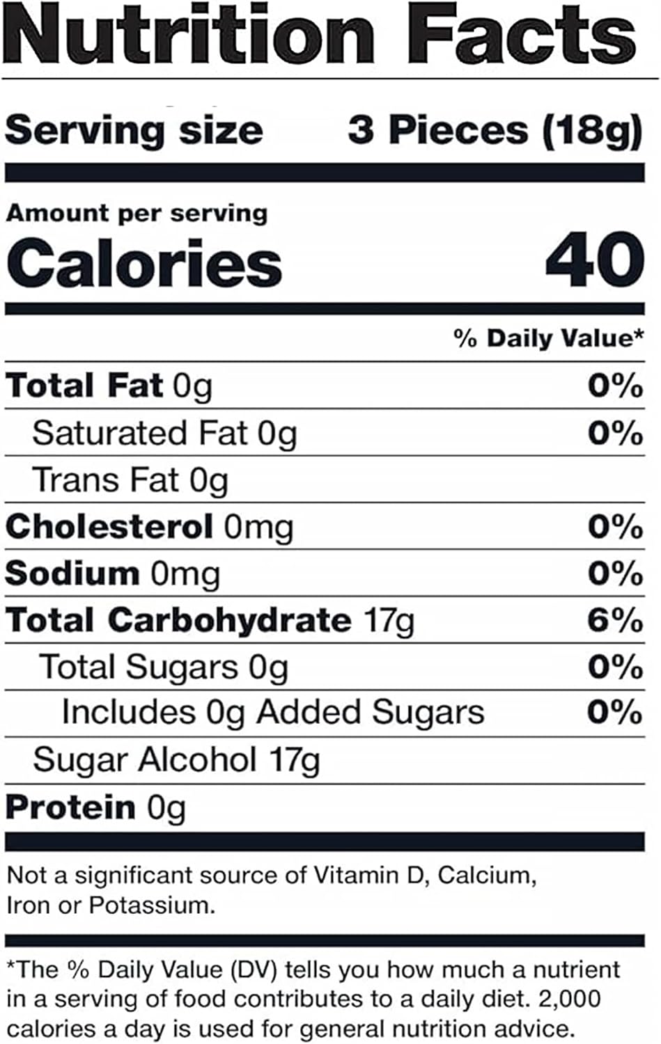 Arcor sugarless hard candy individually wrapped lemon drops spread out on a table.