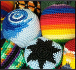A full collection of twelve distinct multi-colored woven kick bags arranged together.