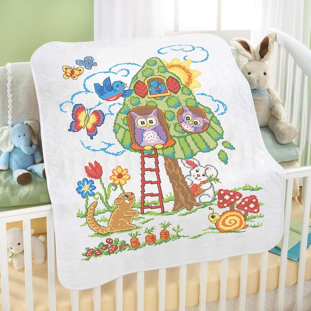 Herrschners Baby Tree House Value Baby Quilt Stamped Cross Stitch Kit front view showing the woodland animal design.