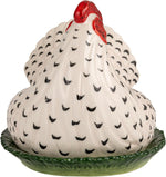 The textured green base of the French country style stoneware butter dish.