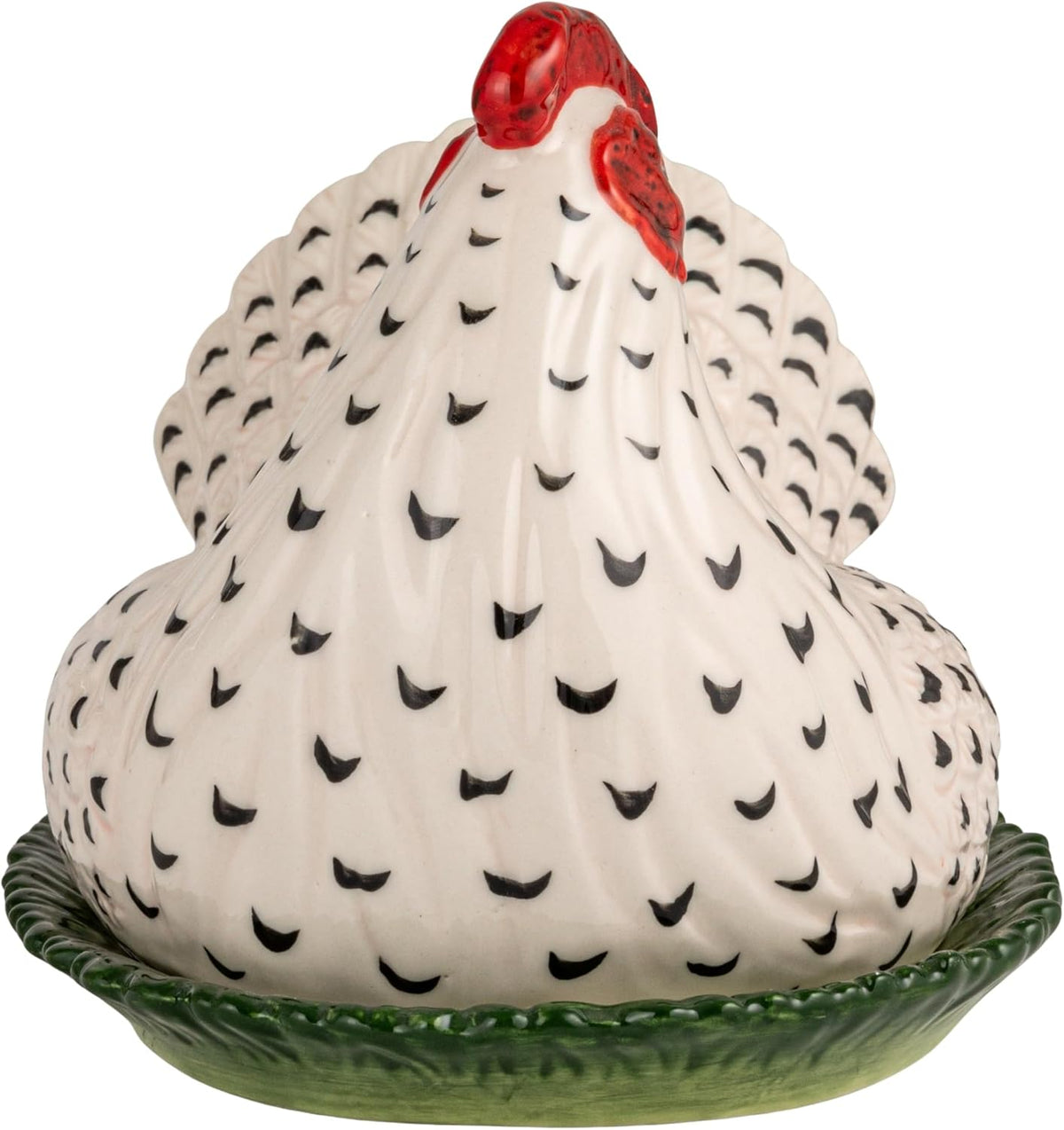 The textured green base of the French country style stoneware butter dish.