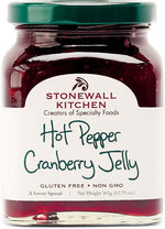 Stonewall Kitchen gourmet red pepper spread applied onto a classic cheese board