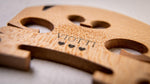 Viotti violin bridge close-up of genuine ebony E-string insert