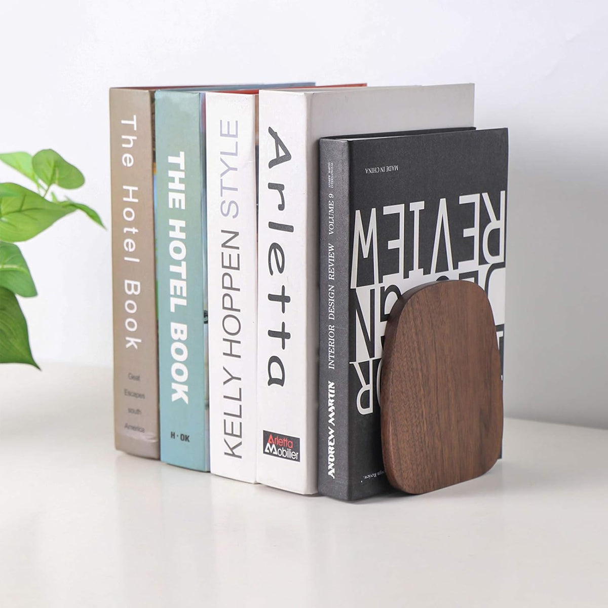 L-shaped profile of wooden bookends arranged on an office desk