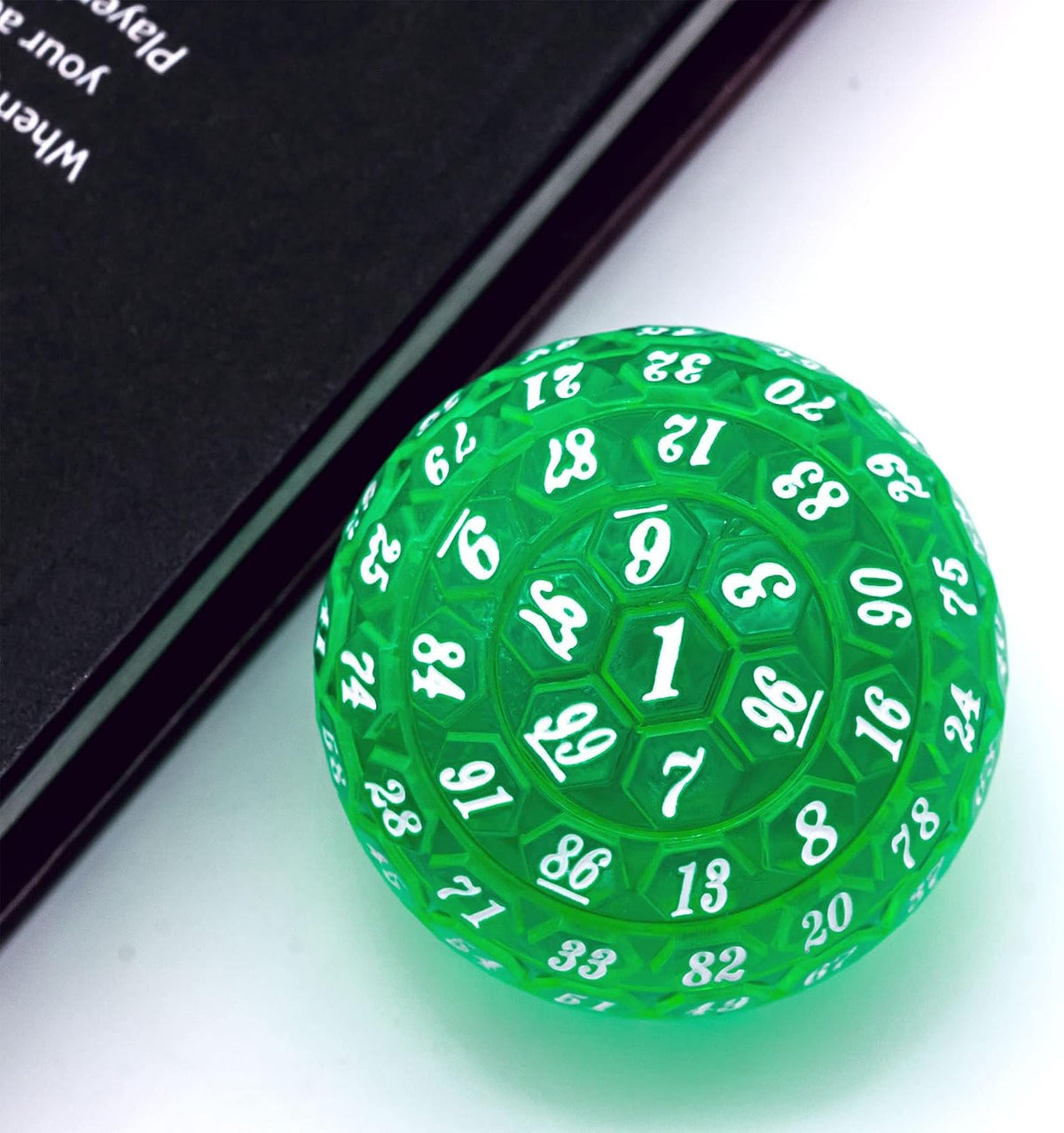 Close up of raised pentagon faces on Poludie D100 green dice