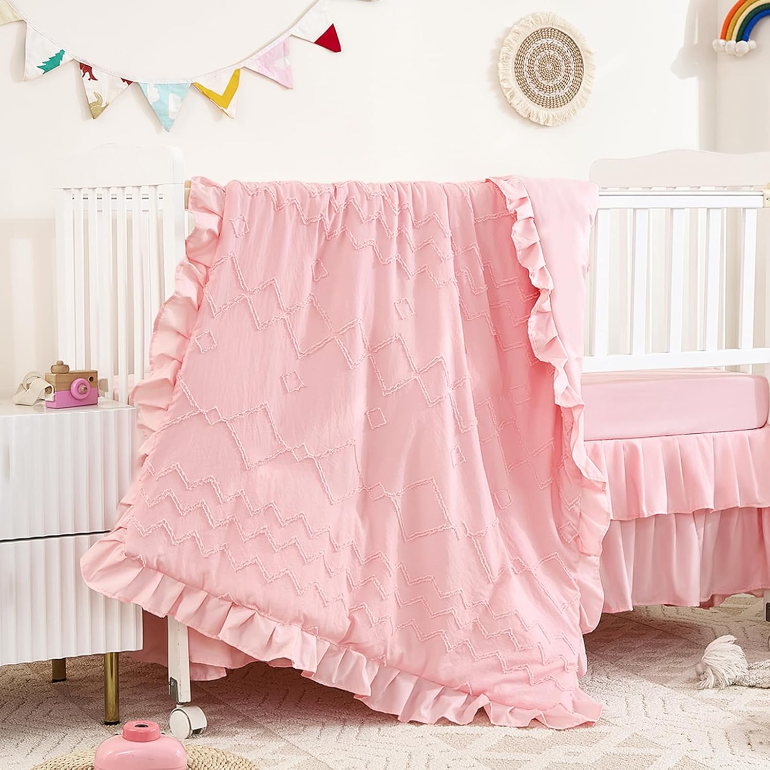 NacoMoco tufted ruffle crib bedding set front view showcasing light pink boho nursery design
