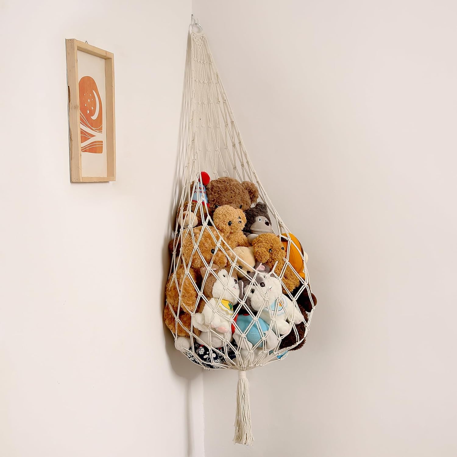 Amdermi stuffed animal storage organizer front view holding plush toys in nursery corner.
