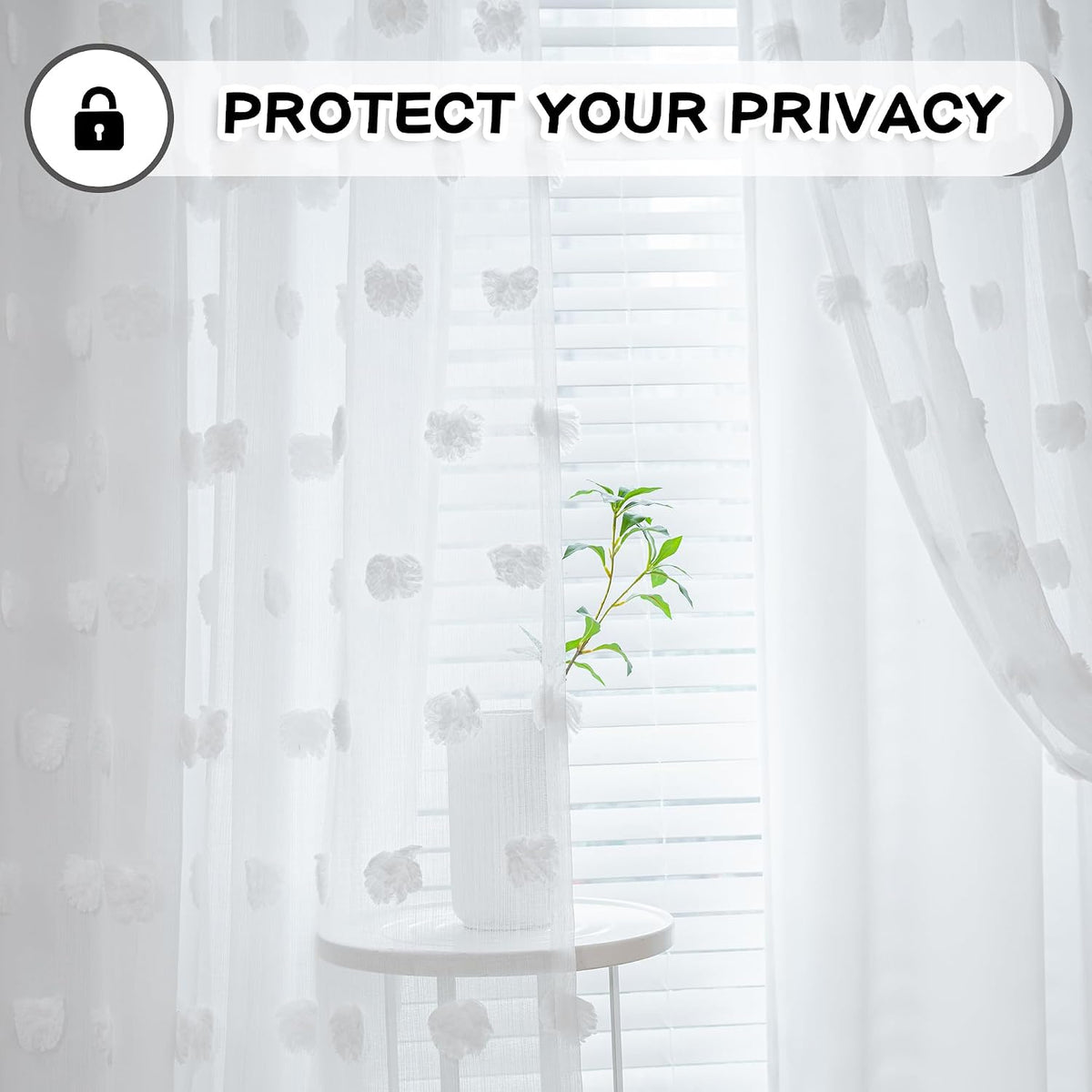 White sheer and blackout layers hanging on window rod