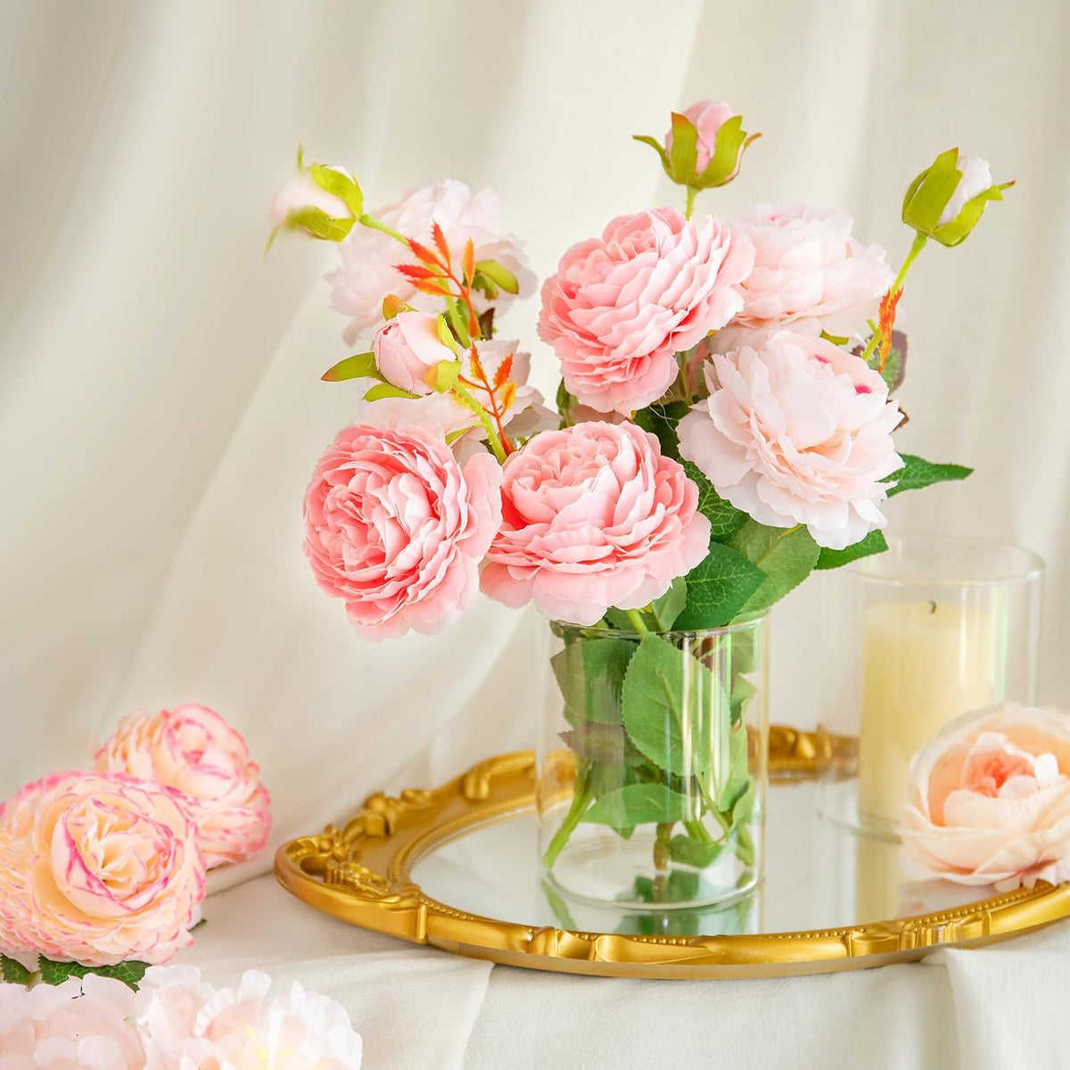 Transparent cylinder glass vases filled with decorative gems and lights