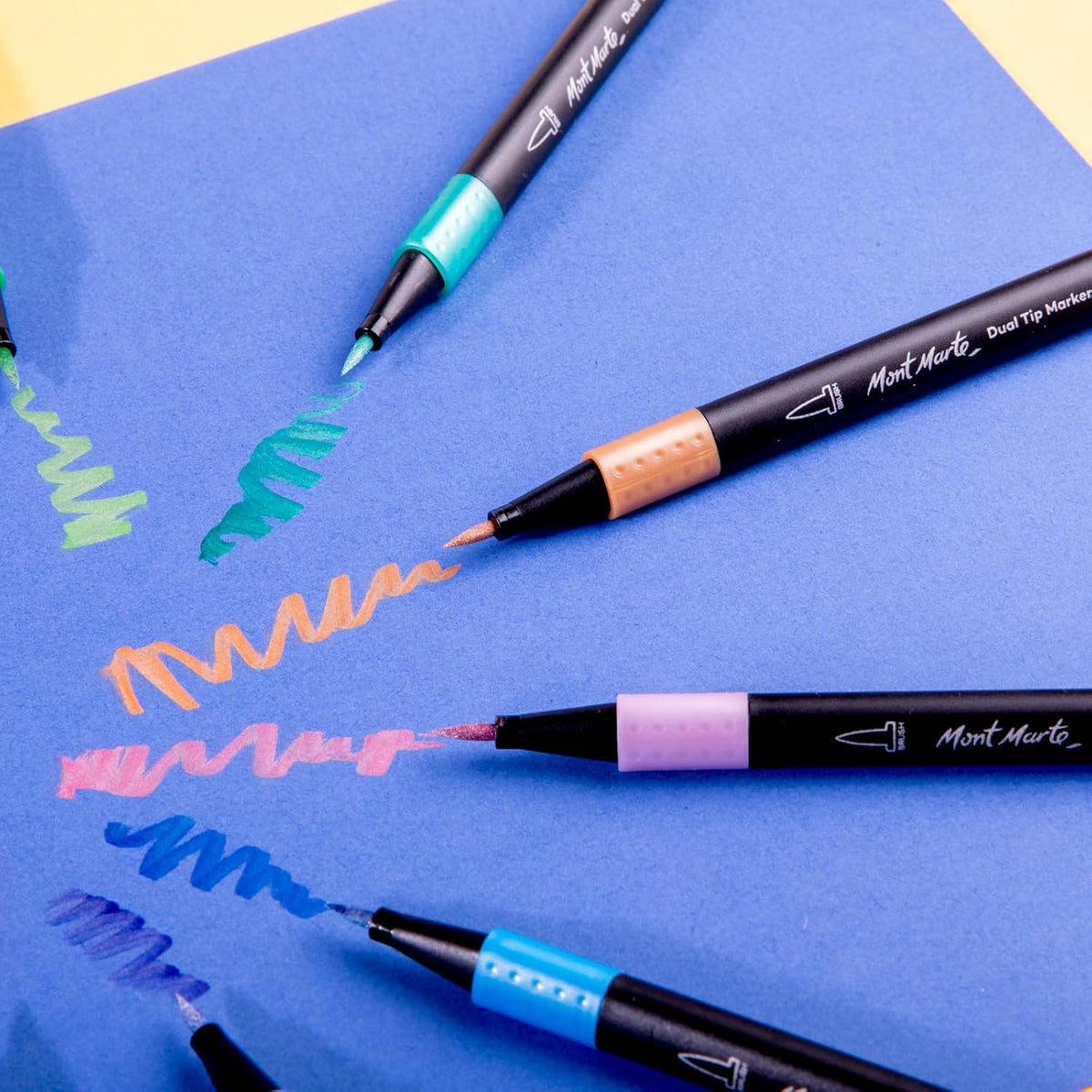 Mont Marte metallic color swatches on dark and light paper
