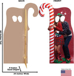 Life size cardboard standee with candy cane prop