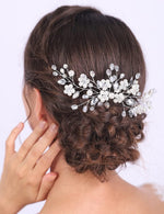 Jumwrit bridal hair comb styled in a detailed braided bun