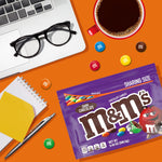 Authentic imported M&M'S Dark Chocolate candy bag held up to display the 9.4 Ounce size