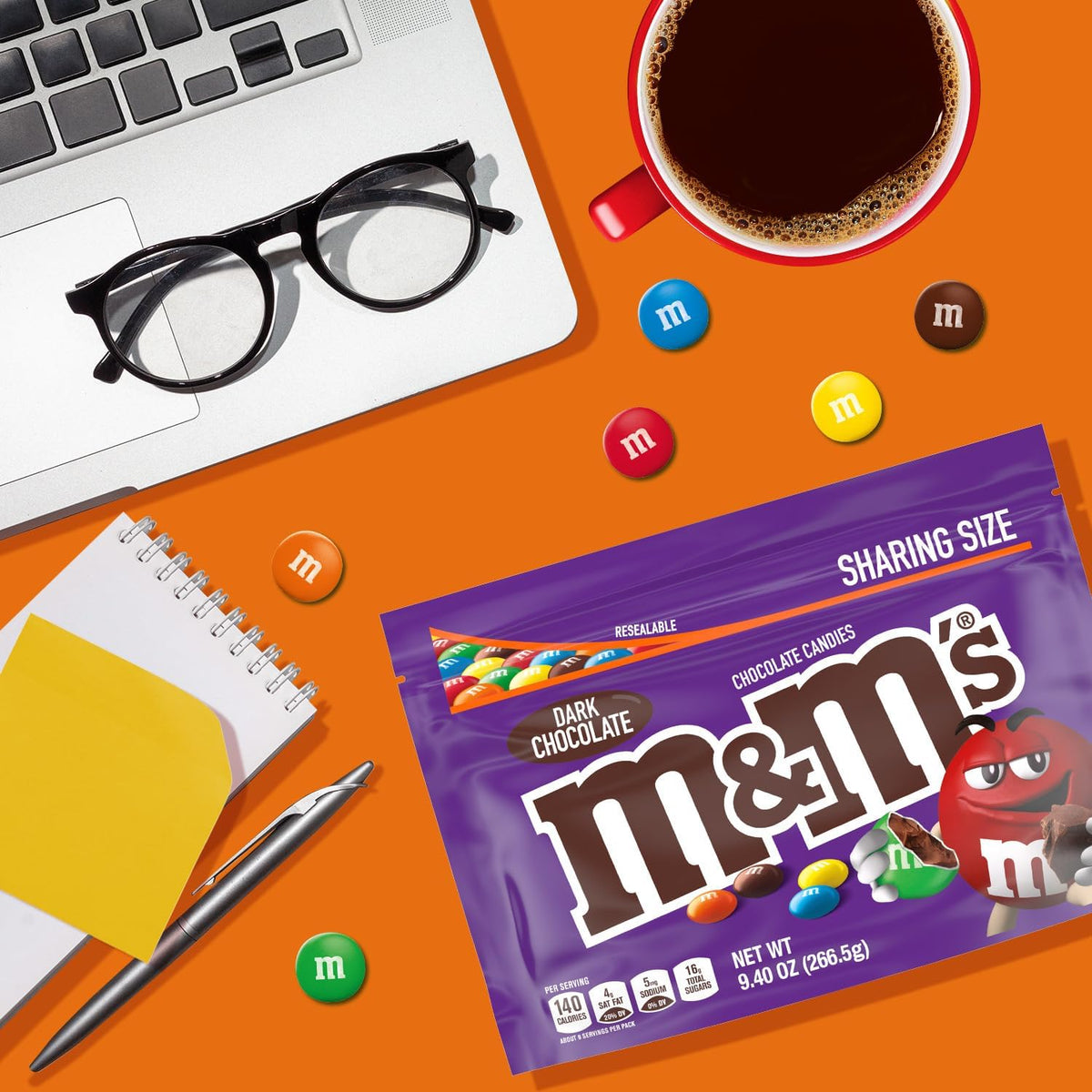Authentic imported M&M'S Dark Chocolate candy bag held up to display the 9.4 Ounce size