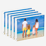 Person cleaning Meetu acrylic picture frame with microfiber cloth
