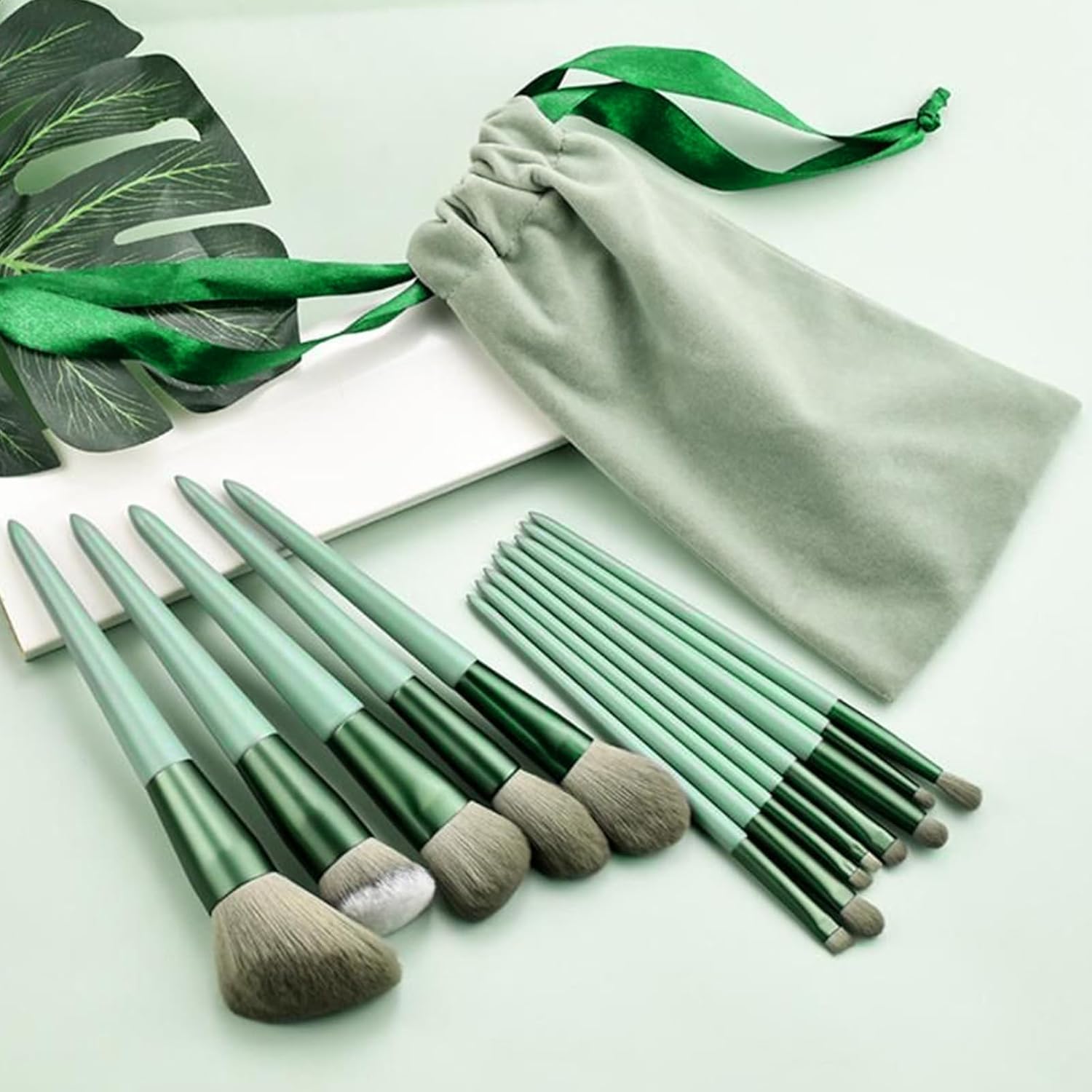 ASJ Traders 13 Piece Soft Makeup Brush Set front view showing all green brushes arranged neatly with the matching travel pouch.