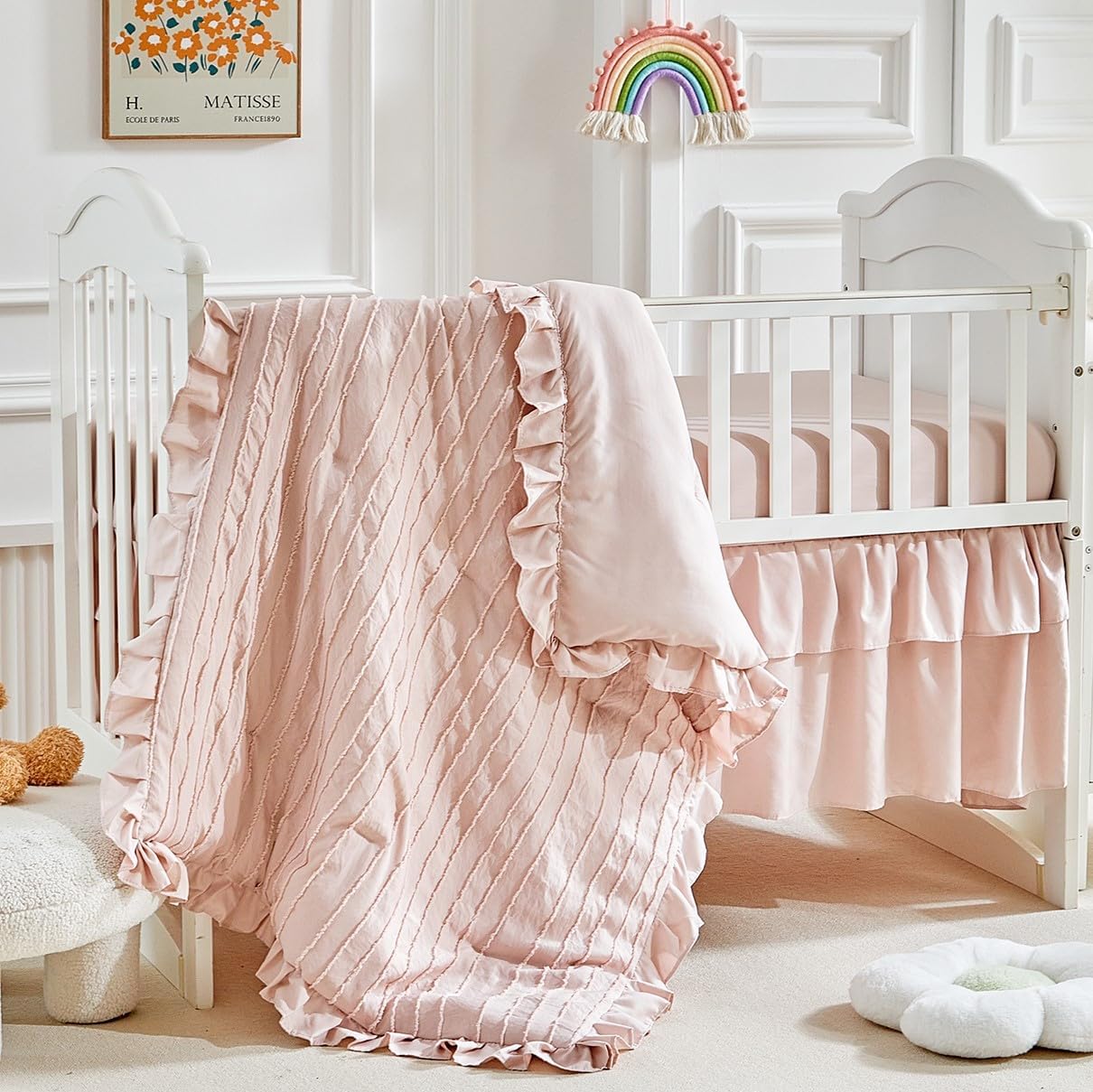 FlySheep 3 pieces tufted stripes crib bedding set front view showing pink ruffled comforter in a baby nursery