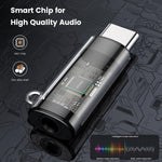 Compact MOSWAG audio converter shown alongside a modern smartphone