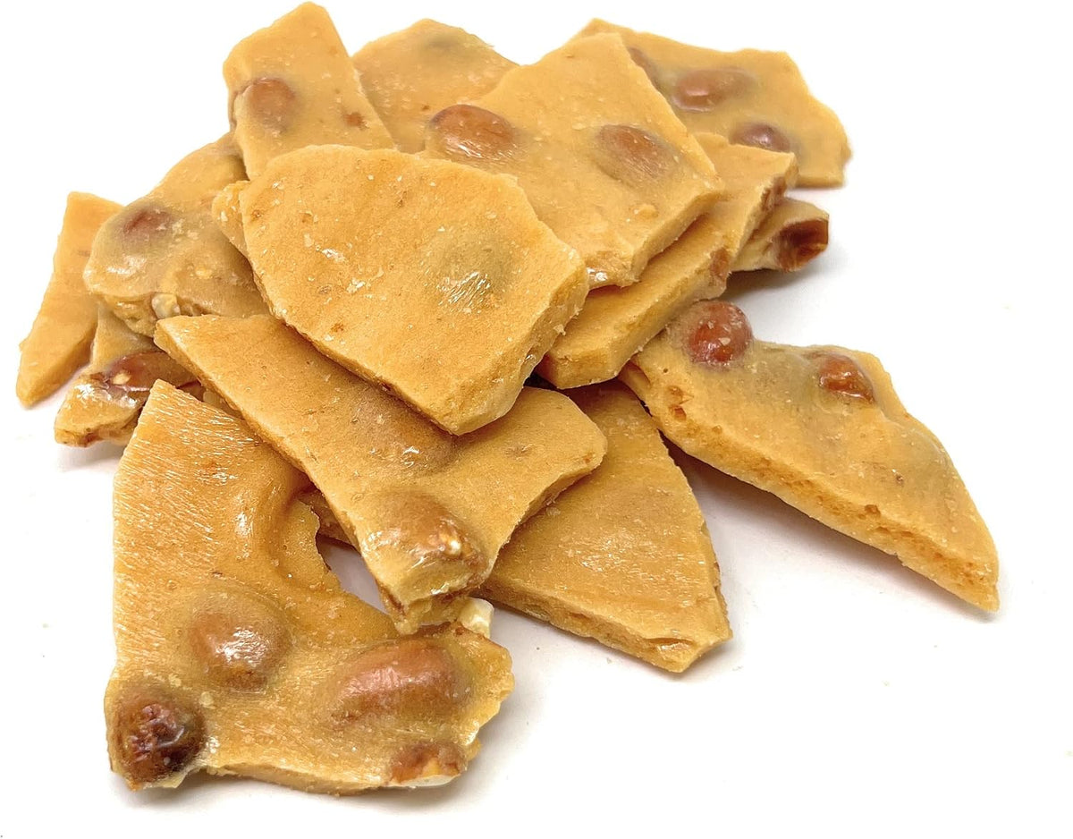 Crispy and thin American imported peanut brittle candy chunks close up