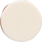 Close-up of Burt's Bees coconut and pear lip balm texture and cap