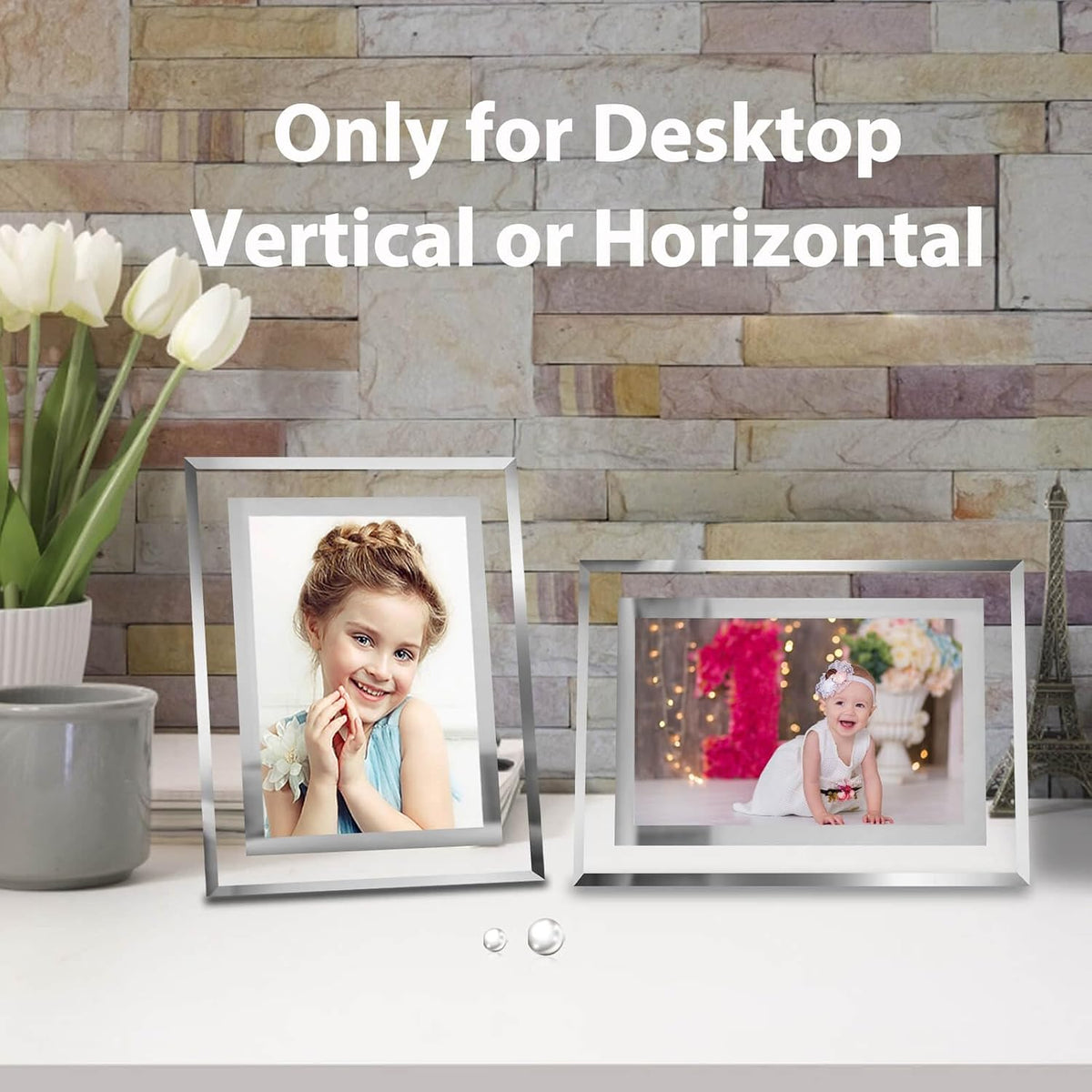 Set of four silver picture frames arranged for tabletop display