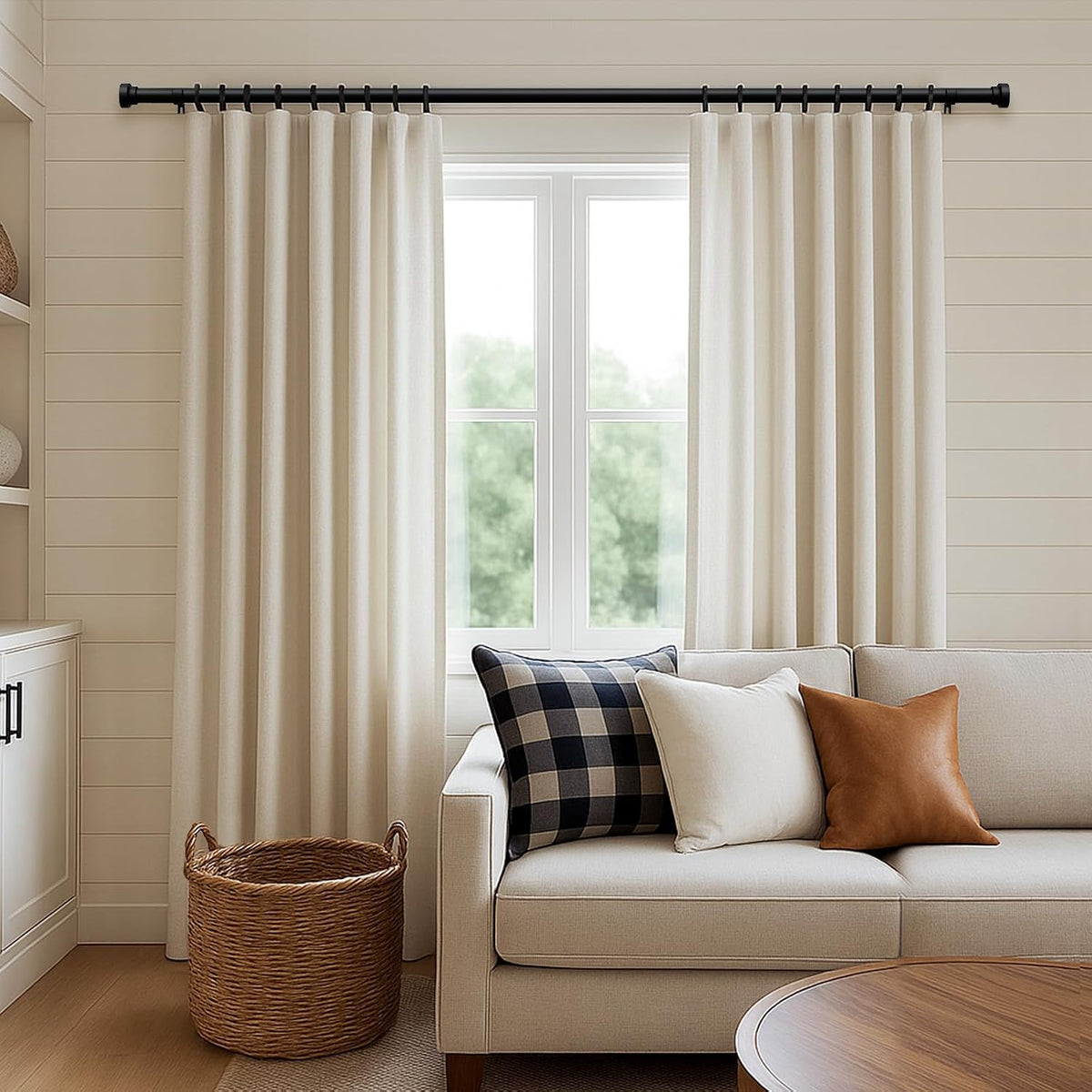 Detailed angle view of the matte black single drapery rod set.