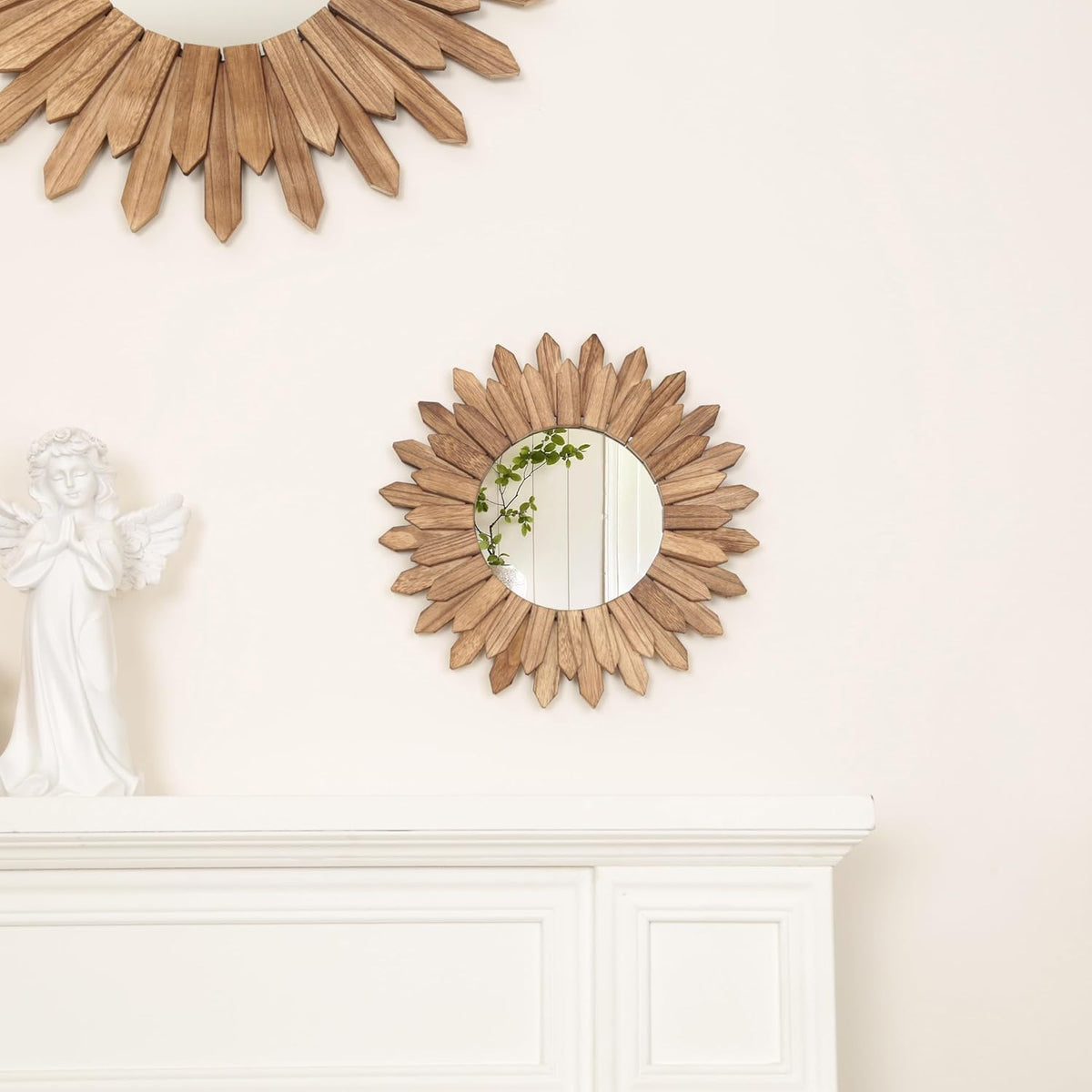 LOSOUR boho sunburst mirror hanging in a modern living room