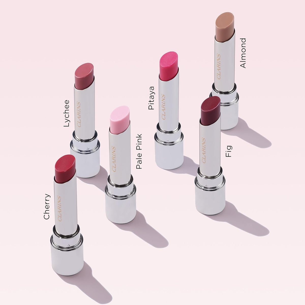 Close-up view of the Clarins lip balm base featuring clean aesthetics and luxury formulation details.