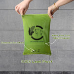 Forest green unscented compostable doggie bags being pulled from dispenser
