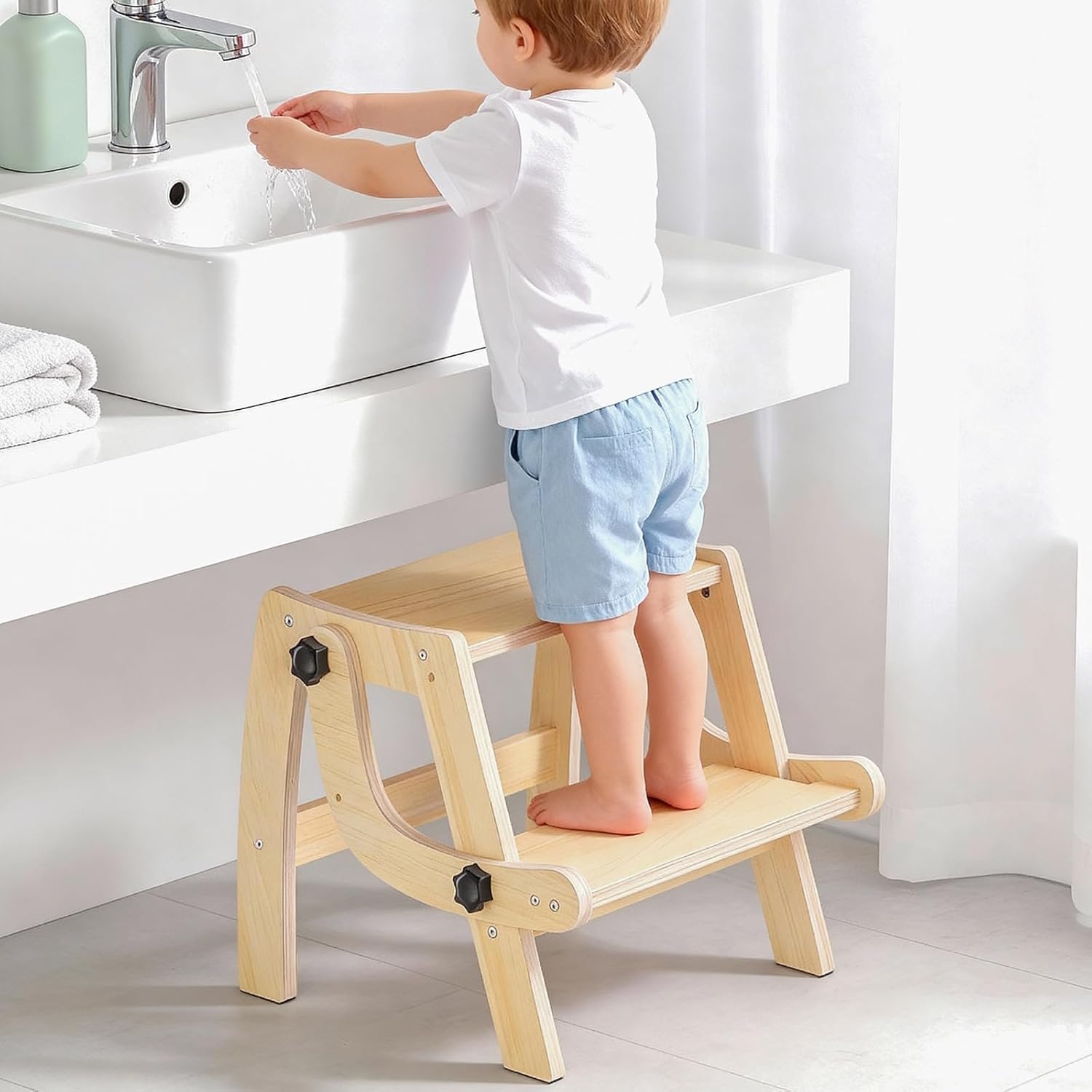 Arwion wooden toddler step stool front view standing near a bathroom sink