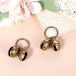 Close up view of the durable brass alloy construction of the Styquenzer pet bell.