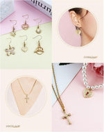 Collection of mixed gold jewelry making charms spread out