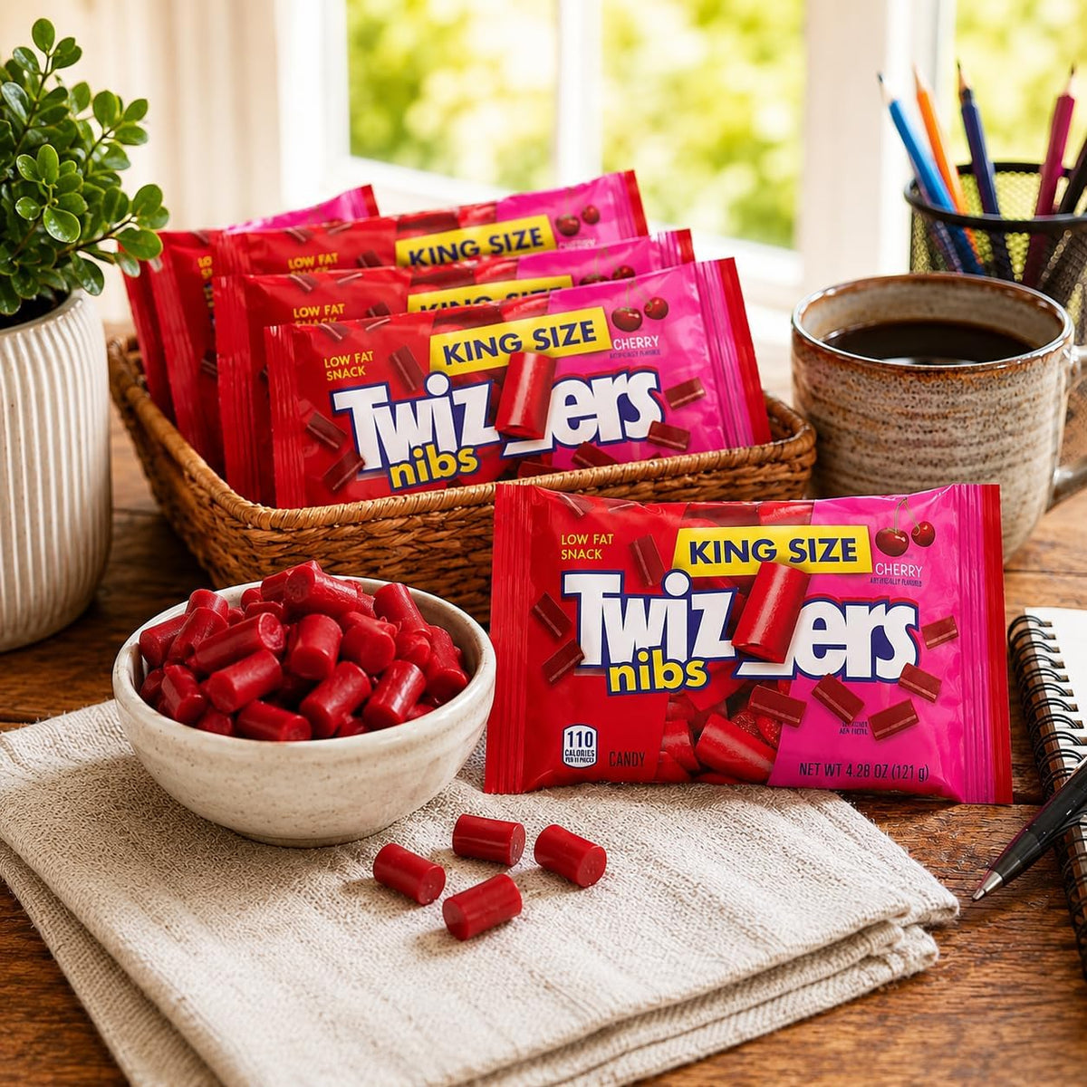 Munchique Twizzlers cherry licorice bites scattered next to the packaging.
