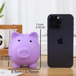 H&W small piggy bank held in hand showing scale